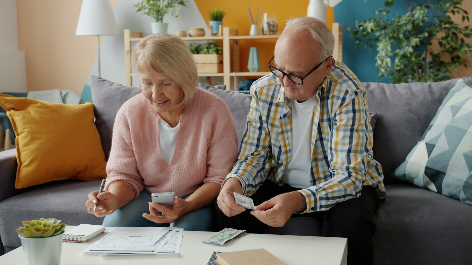 Older couple reviewing papers together at home